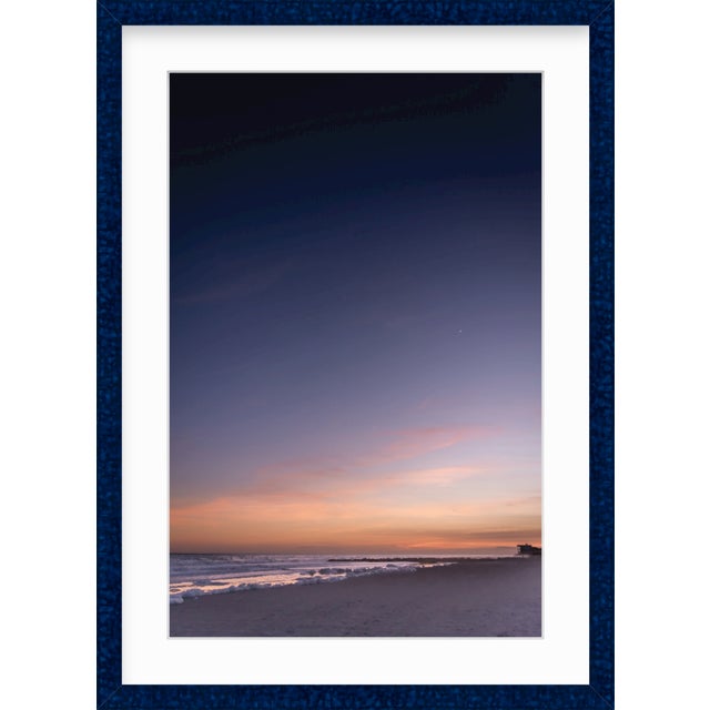 This fine art photograph by Paula McIntosh was taken in Charleston, South Carolina. A Lowcountry sunset reflects off the...