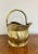Antique Victorian quality brass helmet coal scuttle having a shaped carrying handle with a shaped quality brass helmet...