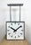 This square double-sided railway, school or factory wall clock was produced by Pragotron, in former Czechoslovakia, during...