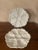 Two white porcelain German oyster plates with six wells, a center well for dipping or lemon in a seashell motif.