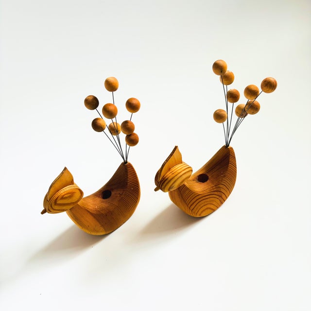 A set of 2 mid century Scandinavian folk art wood bird candle holders. Each with a kinetic tail made of thin metal rods...