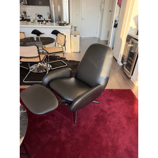 Brand new Design Within Reach Vala swivel recliner. Black leather. Costs $6,000 at design within reach with long lead...