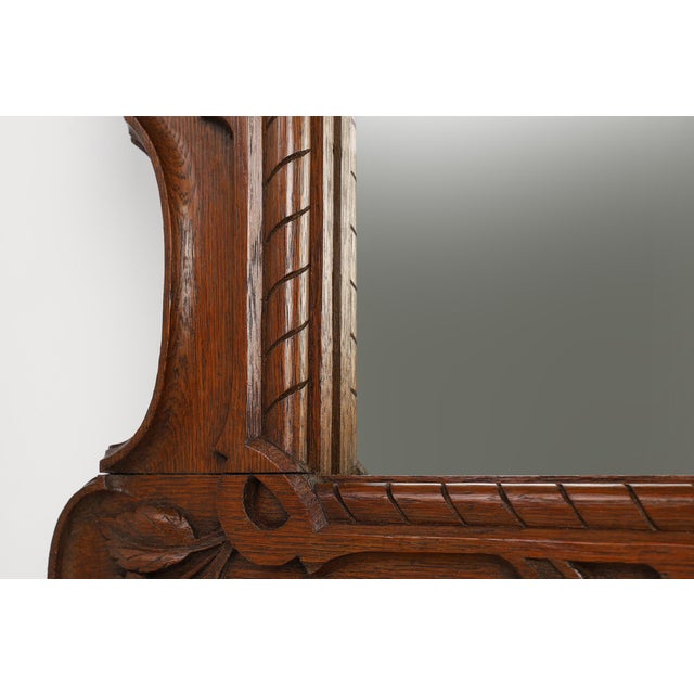 Belgium / 1900 / Mirror / oak / Baroque This imposing wall mirror, crafted in Belgium around 1900, is a masterful homage...
