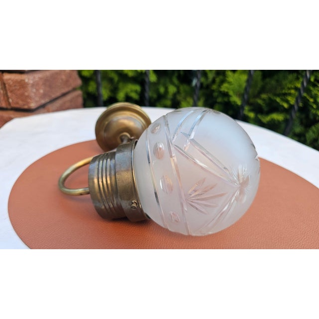 Art Deco brass wall sconce, dimensions: height 23 cm, depth 21 cm, shade diameter 12 cm, wall plate diameter 8.8 cm....
