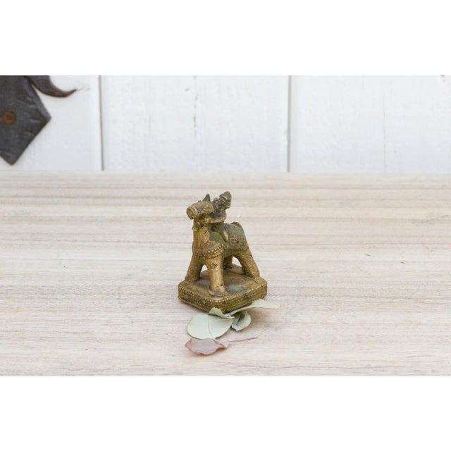 Handcrafted using glistening brass, this petite statuette features a man riding a horse embellished with brass casted...