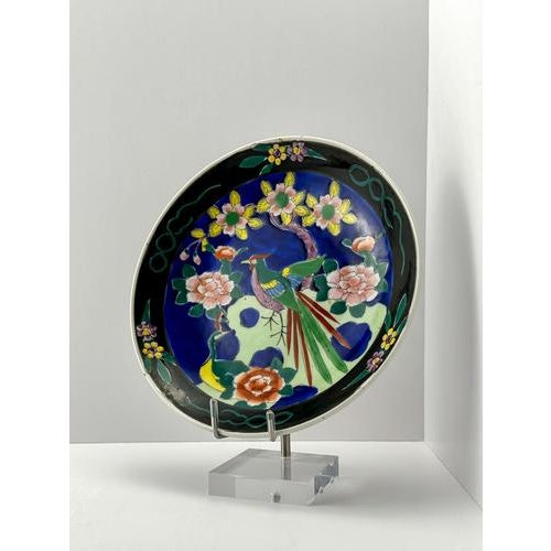 A black and polychromed Japanese, Chinoiserie-style charger plate, handcrafted in the 1940s by Dai Nippon. Hand-enameled...