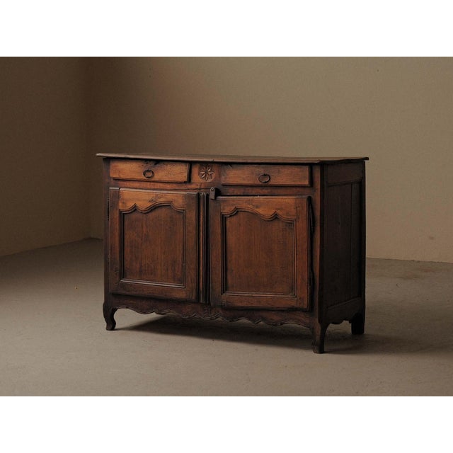 This exceptional French provincial sideboard, crafted from solid oak in the Auvergne region during the 19th century,...