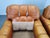 Pair of mid-century lounge armchairs produced in Italy during the 1970s. The armchairs are upholstered in cognac leather...