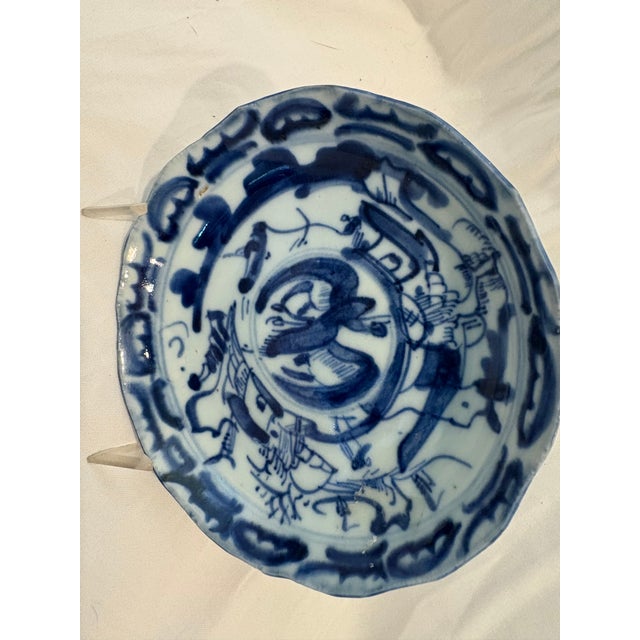 A pair of antique, white porcelain plates with blue hand painted decoration. The pair are in the Qing Dynasty style but it...