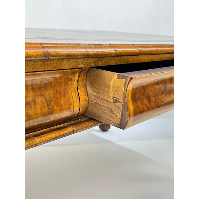 An exceptional partners desk with grand proportions and refined details reflecting the English Georgian period. The top is...