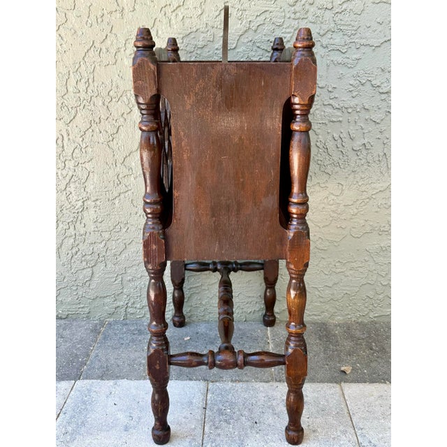 Pretty cut out floral design on the front side with solid panel on opposite side. Divided storage compartment. Turned...