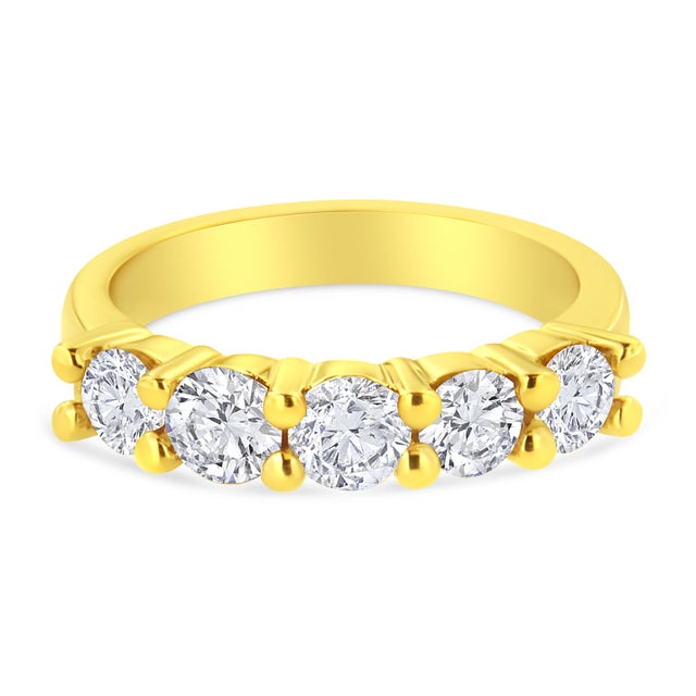 Classic and elegant, this 14k yellow gold plated sterling silver ring is a must have piece. 5 dazzling round cut diamonds...