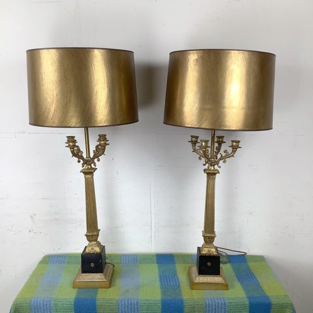 This refined pair of brass table lamps is designed in the Charles X–inspired Neoclassical tradition, drawing directly from...