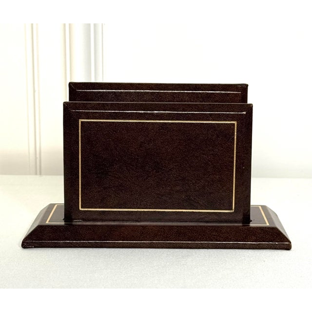 A classic, yet traditional style genuine small brown leather letter holder has gold tooling throughout on the rectangular...