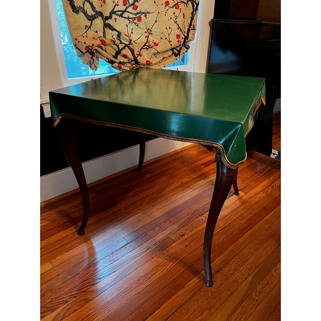 One of a Kind French Card Table with a square green painted top in the form of a fabric covering with gilt edges resting...