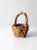 Vintage twig basket featuring a rustic woven form with natural moss entwined throughout, creating a charming nest-like...