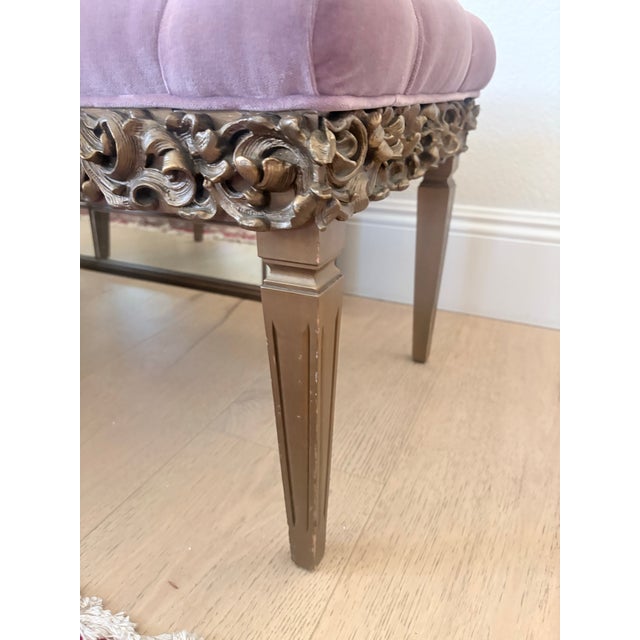 A glamorous vintage Hollywood Regency style bench featuring plush dusty rose pink velvet upholstery with exceptionally...