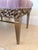 A glamorous vintage Hollywood Regency style bench featuring plush dusty rose pink velvet upholstery with exceptionally...