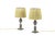 Pair of small lamps in git and metallic grey bronze standing on a small quadripod squared base. Ovoid shape shaft standing...