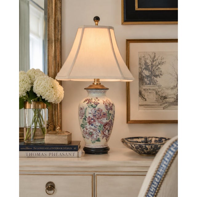 A beautifully hand‑painted and embossed Chinese porcelain vase lamp, featuring richly detailed peony florals in shades of...