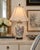 A beautifully hand‑painted and embossed Chinese porcelain vase lamp, featuring richly detailed peony florals in shades of...