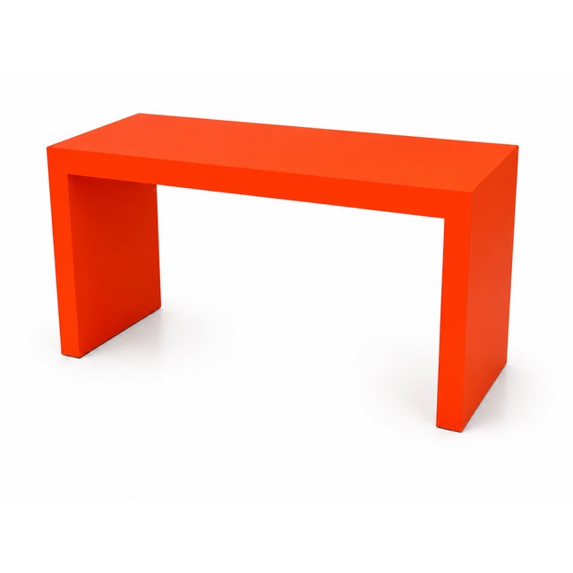 Custom made console done in a white lacquer finish. The console has clean lines. The dims are 34" tall 5' long and 20"...
