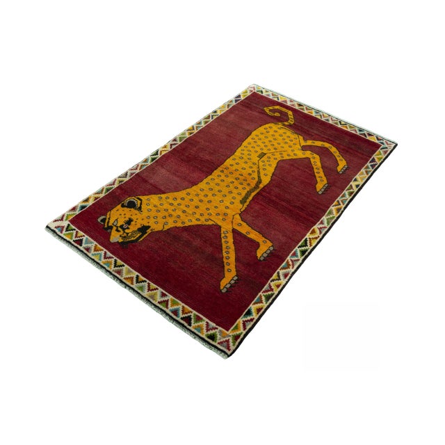 An impressive hand-knotted Gabbeh nomad rug measuring 178 x 107 cm. The expressive tiger motif in bright yellow stands out...