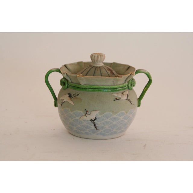 Delicate and charming matching Satsuma Japanese earthenware bowls with finely painted birds. One pot has twin handles and...