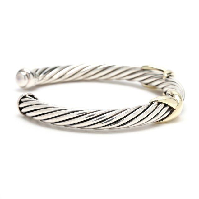 Circumference: 7 inch w/ 1 inch opening Width: 7.1 mm Weight: 28.8 dwts. / 44.8 grams Stamps: "925 585 DY" *double X SKU:...