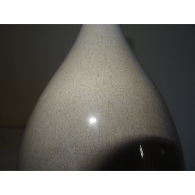 A fine quality vase with an interesting glazing with a contemporary look. Comes with stand Height of vase without stand:...