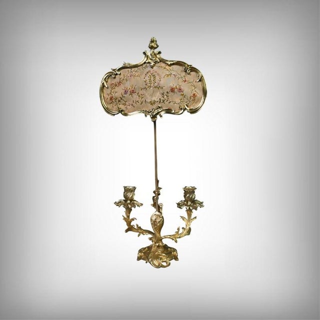 Elegant and refined, this large, two-light gilt bronze candelabra embodies all the decorative charm of the 19th century....
