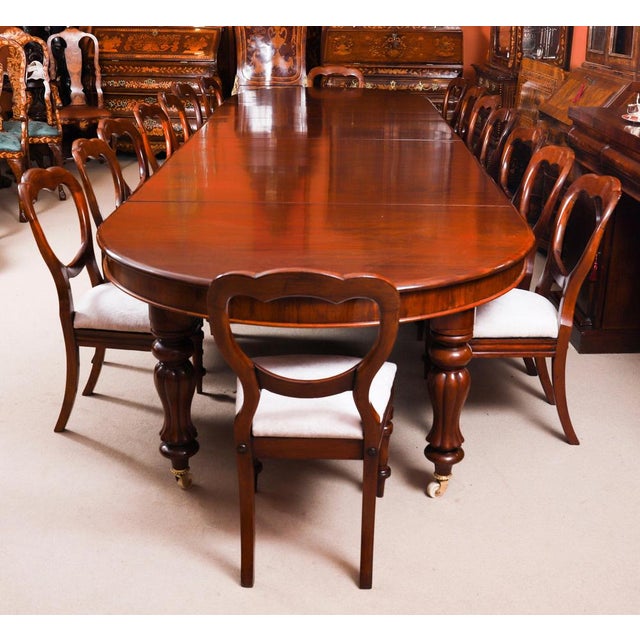 This is a beautiful dining set comprising an antique George III flame mahogany dining table, Circa 1810 in date, and a...