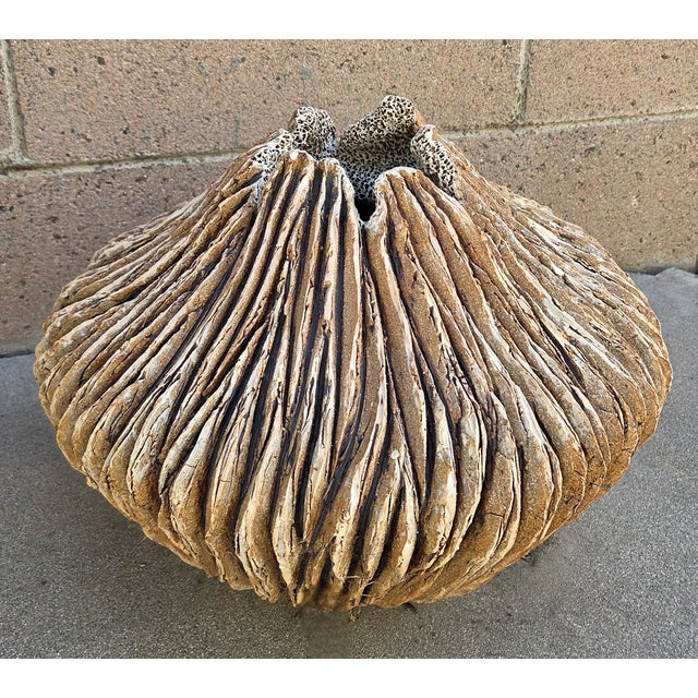 This large ceramic stoneware vase/Vessel by Anne Goldman features a bark-like texture in natural clay. The interior has an...