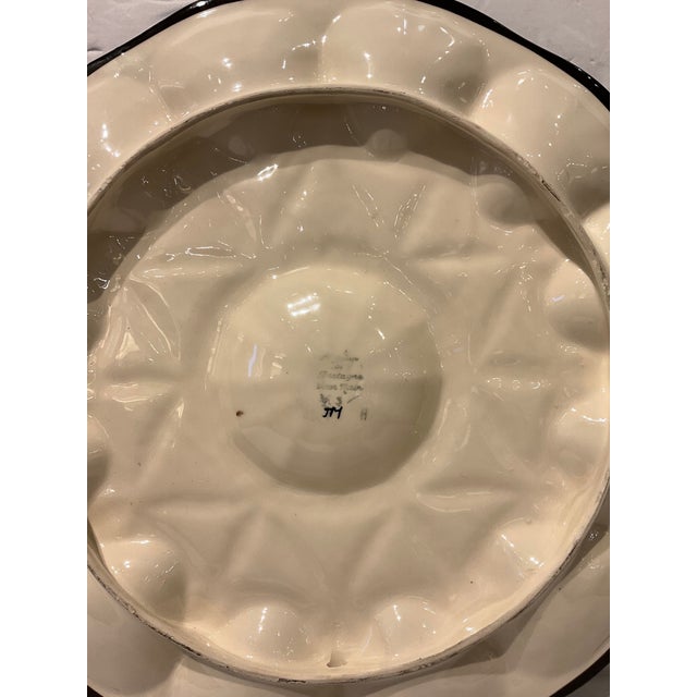 This vintage majolica oyster platter has a beautiful, eye-catching multicolor design! It features 12 wells in a yellow and...