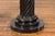 A pair of vintage Thai black Carrara marble pedestals with bronze Corinthian capitals and twisted columns. Created during...