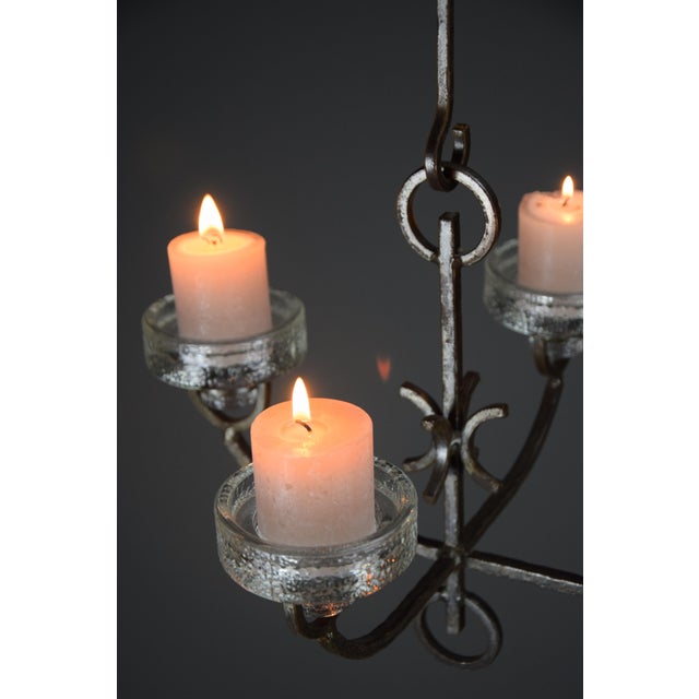 Elevate your interior design with this exquisite mid-century modern wrought iron and glass ceiling candle holder, a...