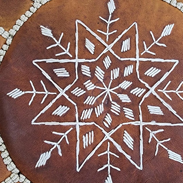 Add warmth and timeless character to your space with this handcrafted Moroccan leather pouf cover, expertly made by...