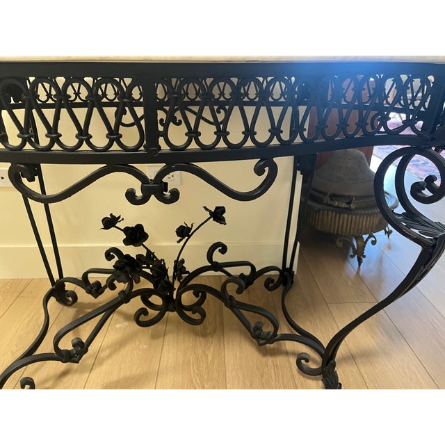 A beautiful 20th-century iron with a White marble top table. The table has a wonderful scrolled wrought-iron base with...