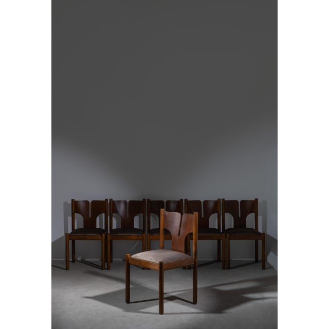 A set of 6 dining chairs from the Mobilgirgi, made in Italy in 1970s. Solid walnut construction with fabric seats. Over...