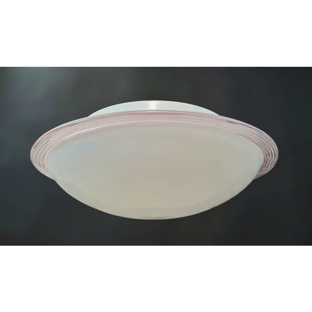 Vintage Italian flush mount or wall light with a single milky white Murano glass shade enclosed in clear border with thin...