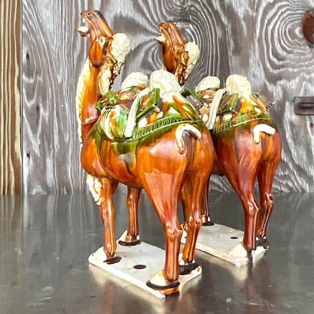 A fantastic pair of vintage Boho ceramic camels. A chic tri color Sancai glaze on a pair of handsome figures. Acquired...
