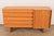 A gorgeous Mid-Century Modern sculpted oak tambour door sideboard, credenza, or dresser By Harold Schwartz for Romweber...