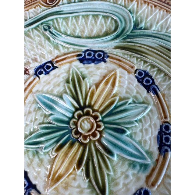 An antique barbitone majolica plate with detailed, textured surface and rich, vivid colors. Add to a plate wall, table...