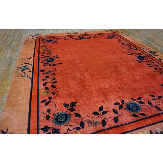 Coral 1920s Wool Antique Square Hand Knotted Pile Floral Rug, Circa Date: 1920s. This exceptional piece exemplifies the...