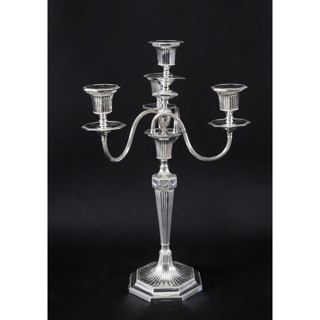 This is a truly magnificent and highly distinguished pair of antique Victorian silver-plated four-light three-branch table...