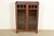 A beautiful antique Mission or Arts & Crafts period glass front bookcase or display cabinet In the manner of Charles P....