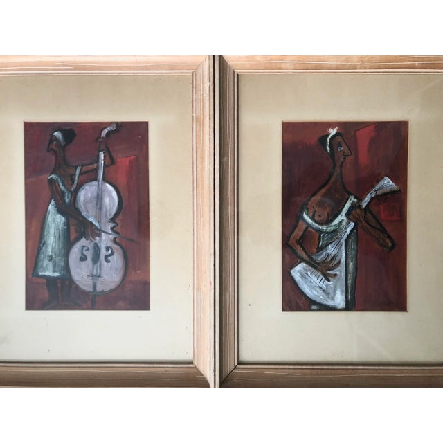 Stunning pair of mid-century paintings by noted artist Charles Griffin Farr. These are done in shades of red, black and...