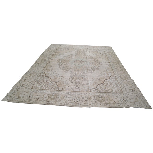 Vintage Tabriz Hand-knotted with care using traditional rug-making techniques, this wool rug blends timeless craftsmanship...