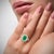 2.22 carat natural Colombian Emerald and Diamond Ring. Centering a lustrous emerald-cut emerald, measuring 10.3 x 6 MM, a...