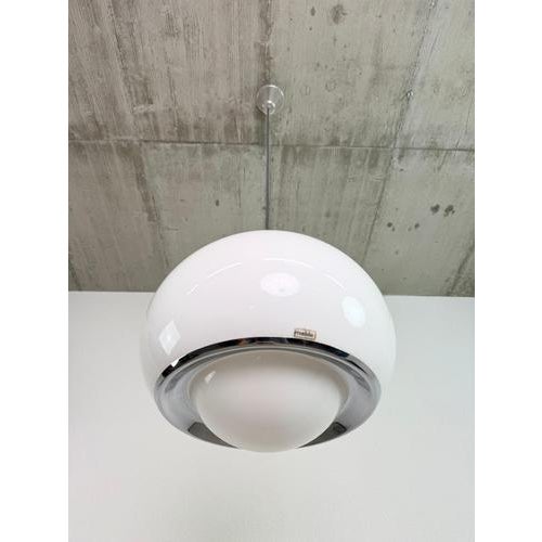 An iconic mid-century modern "bud" (model 3029) pendant light, designed by studio 6g for the legendary italian...